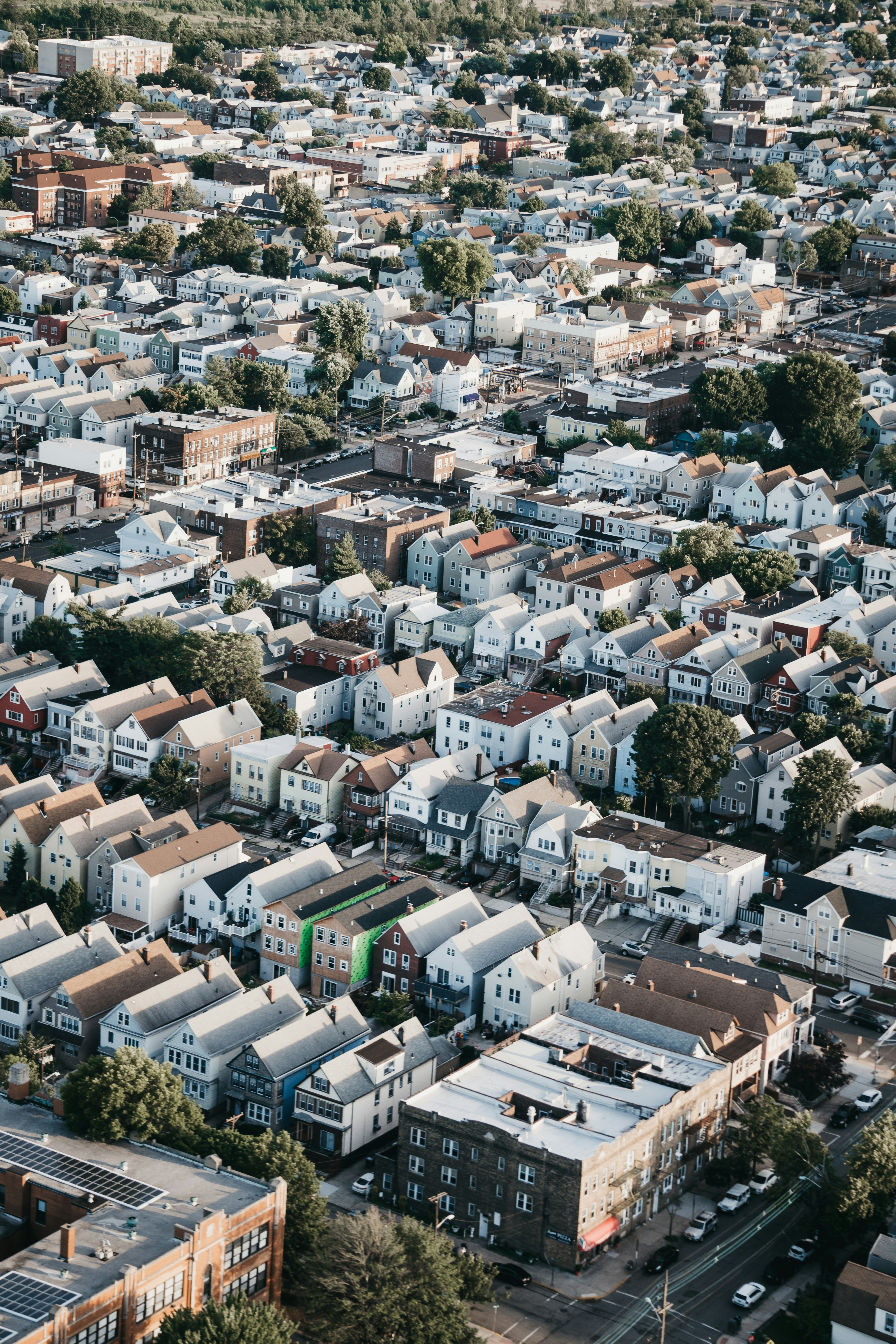 Aerial view of Jersey City's varied neighborhoods with the Manhattan skyline in the background
