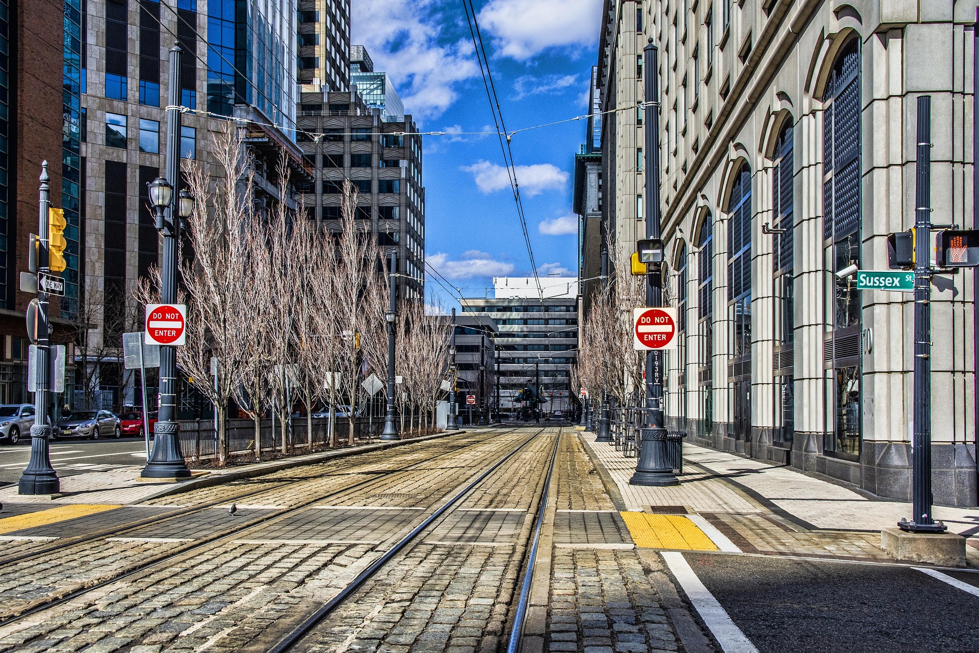 Jersey City street with light rail tracks — extended stay and temporary housing