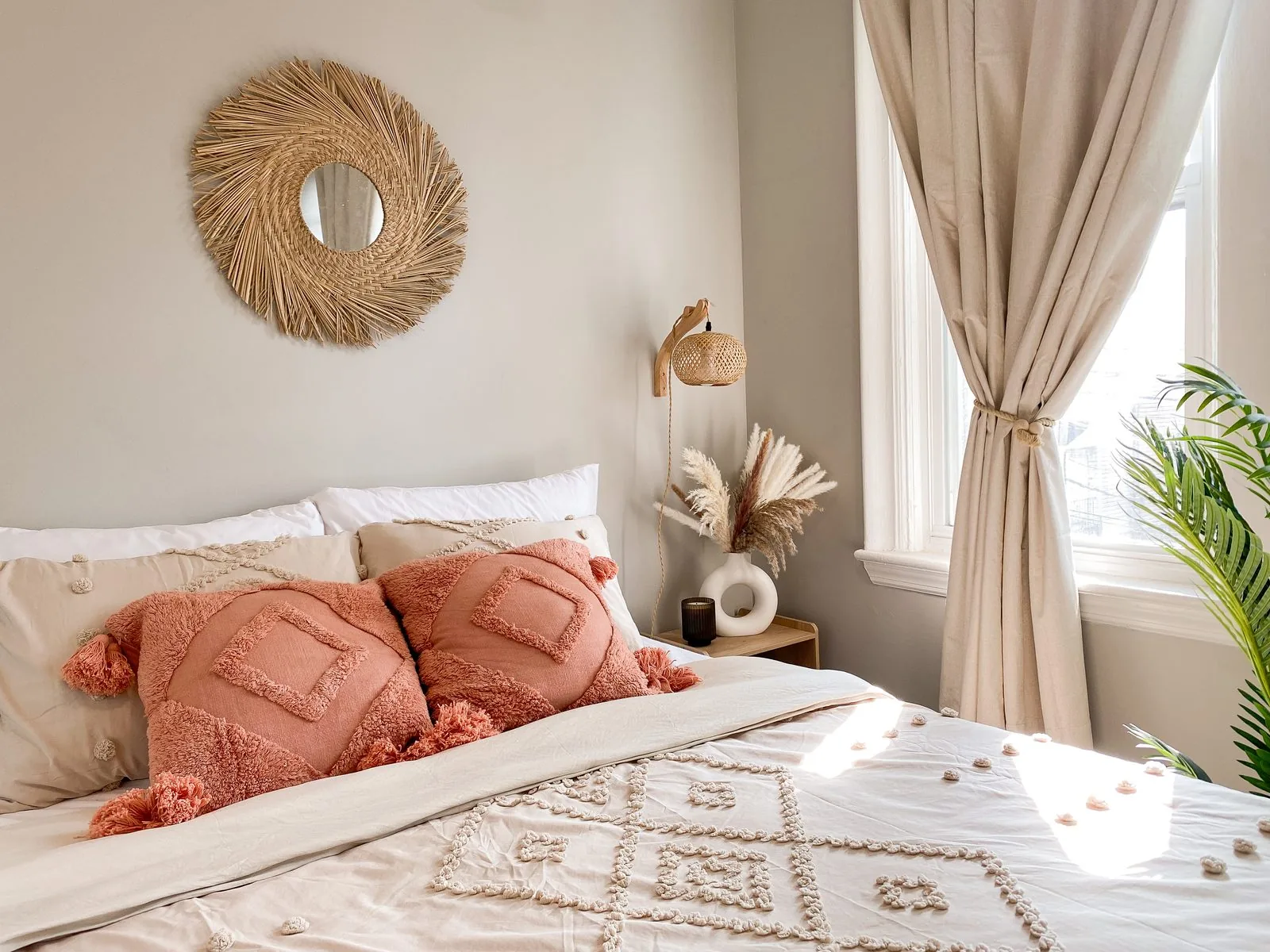 Bedroom 1 detail — cognac chair, brass clock, charcoal wall