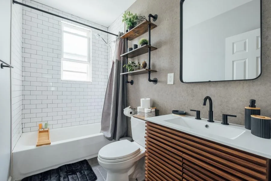 Industrial bathroom with pipe shelving