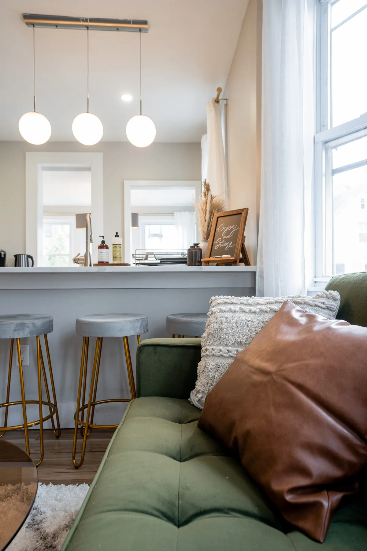 Living area with bar seating and pendant lights